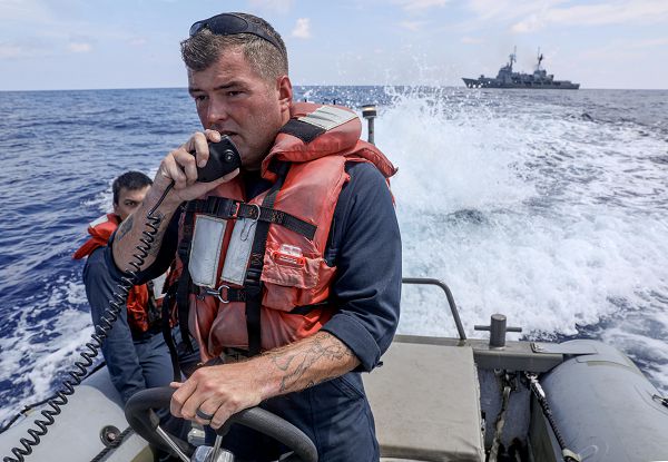 SOUTH CHINA SEA (Oct. 21, 2023) Chief Boatswain’s Mate Dustin Lewis, from Chattanooga, Tennessee, assigned to the Arleigh Burke-class guided-missile destroyer USS Dewey (DDG 105), pilots a rigid-hull inflatable boat after departing the Philippine navy offshore patrol vessel BRP Gregorio del Pilar (PS 15) during a bilateral sail while operating in the South China Sea, Oct. 21, 2023. Dewey is forward-deployed and assigned to Commander, Task Force 71/Destroyer Squadron (DESRON) 15, the Navy’s largest DESRON and the U.S. 7th Fleet’s principal surface force. (U.S. Navy photo by Mass Communication Specialist 1st Class Greg Johnson) 