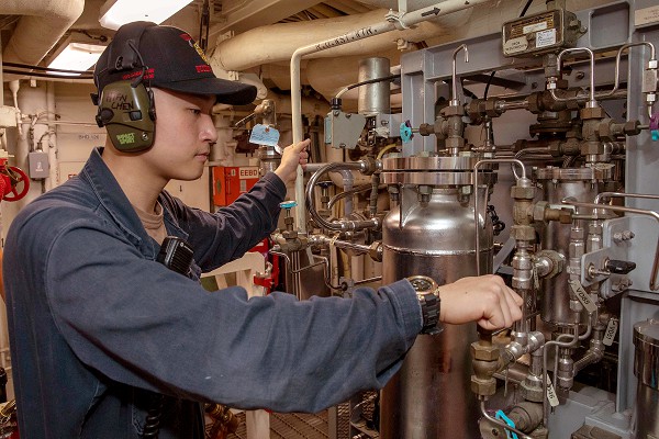 ATLANTIC OCEAN (March 30, 2023) Hull Maintenance Technician Fireman Wenwei Chen aligns a reverse osmosis demineralizer aboard the Arleigh Burke-class guided-missile destroyer USS Nitze (DDG 94), March 30, 2023. Nitze is part of the George H.W. Bush Carrier Strike Group and is on a scheduled deployment in the U.S. Naval Forces Europe area of operations, employed by U.S. 6th Fleet to defend U.S., allied, and partner interests. (U.S. Navy photo by Mass Communication Specialist 2nd Class Cryton Vandiesal)