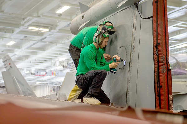 PACIFIC OCEAN (April 2, 2023) Aviation Electronics Technician 2nd Class Garrett Fogg, from Augusta, Ga., conducts maintenance on an EA-18G Growler assigned to the “Gauntlets” of Electronic Attack Squadron (VAQ) 136 in the hangar bay aboard the Nimitz-class aircraft carrier USS Carl Vinson (CVN 70). Carl Vinson is currently underway conducting Tailored Ship’s Training Availability/Final Evaluation Problem certification. (U.S. Navy photo by Mass Communication Specialist 3rd Class Leon Vonguyen)