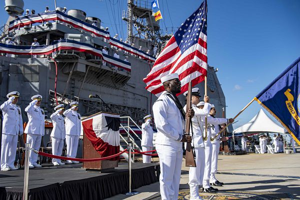 230915-N-TY639-1158 NORFOLK, Virginia (Sept. 15, 2023) - Sailors participate in the national anthem during the decommissioning ceremony of USS San Jacinto (CG 56). San Jacinto was decommissioned after more than 35 years of service. Modern U.S. Navy guided-missile cruisers perform multiple mission including Air Warfare (AW), Undersea Warfare (USW), Naval Surface Fire Support (NSFS) and Surface Warfare (SUW) surface combatants capable of supporting carrier battle groups, amphibious forces or operating independently and as flagships of surface action groups. (U.S. Navy photo by Mass Communication 2nd Class Matthew Nass)