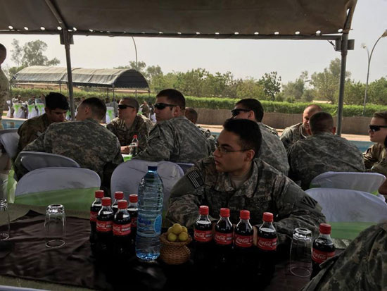 Pfc. Francisco Arias (front), and other Soldiers assigned to Company A, 1st Battalion, 30th Infantry Regiment, 2nd Infantry Brigade Combat Team, 3rd Infantry Division listen to remarks given by their leadership March 26, 2016 at Contingency Location Garoua, Cameroon. Soldiers from 2nd IBCT provide non-lethal support to their Cameroonian hosts as part of U.S. Africa Command. (Photo by Spc. Jonathan Singletary)