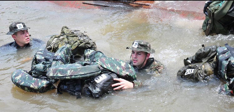 New York Air National Guard Senior Airman Caleb Lapinel trains on tactical swimming in a Brazilian river in October 2020 while attending the  international course conducted annually by the Brazil Jungle Warfare Center, known as CIGS for its Portugese initials. Lapinel was the only American in the class of ten.( Courtesy Photo)