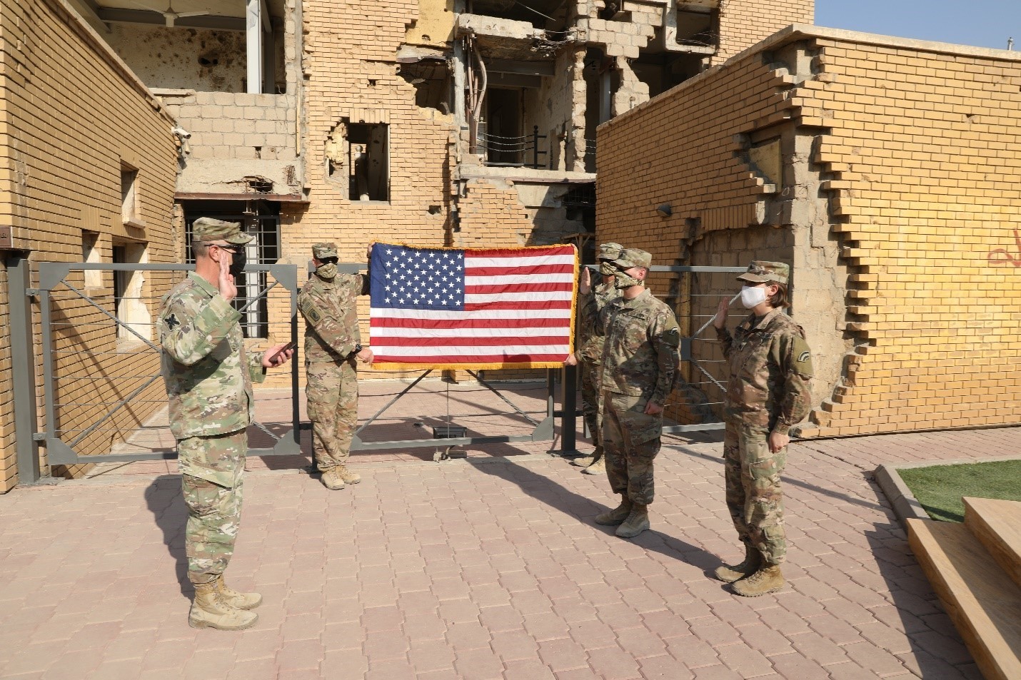 U.S. Army Staff Sgt. A. Jared Forst and Sgt. Becca Meerwarth take their oath of reenlistment Oct. 30, 2020, in Kuwait. The reenlistment was carried out at the Kuwait Martyr’s Museum with Col. Sean Flynn administering the oath. (U.S. Army photo by Sgt. Trevor Cullen)